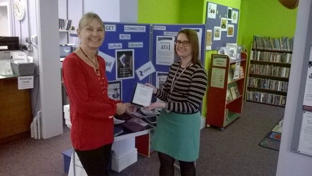Helen Haynes (right) does some iPad lending
