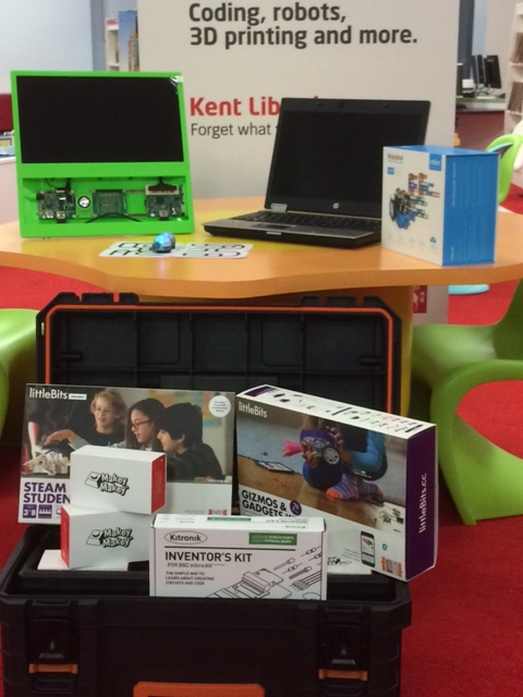 Photo of various digital equipment in a black box and on a table.