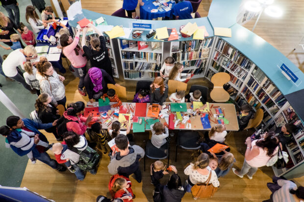 Photo looking down on children having lunch at the library.