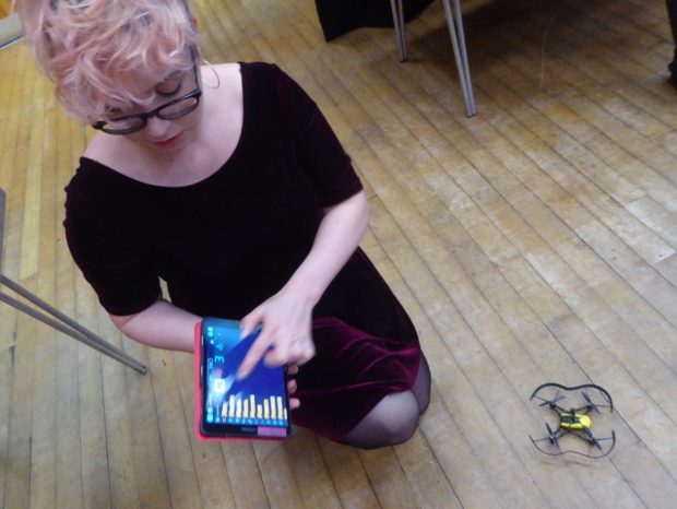 Amy Hearn about to launch a drone. Photo credit: Julia Chandler/Libraries Taskforce