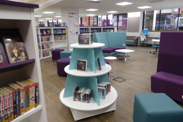 Photo of a library with books and comfy seating