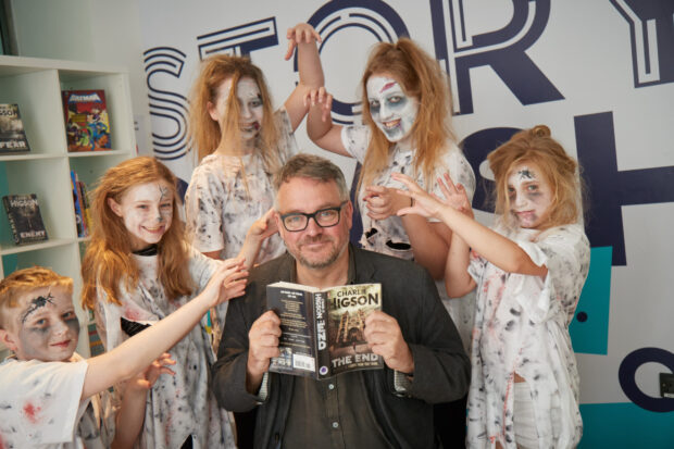 Charlie Higson, surrounded by ghouls. Photo credit: James Hunter