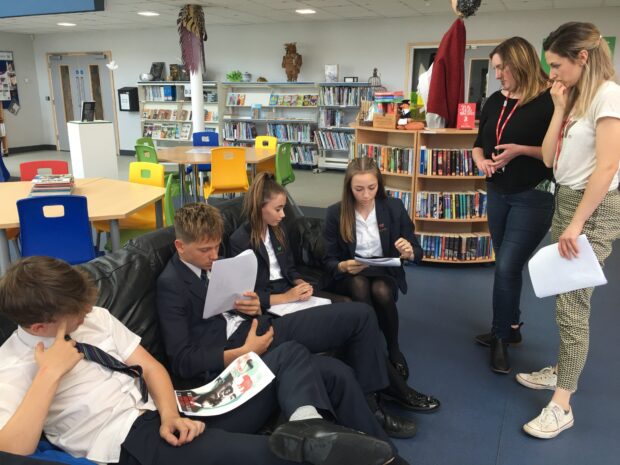 Photo of library staff working with young people in the Sybil Andrews Academy. 