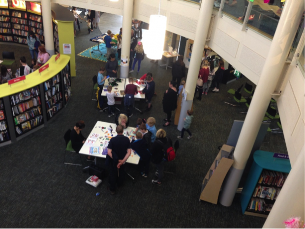 Photo of inside Worksop library looking down from the first floor gallery into the space below.