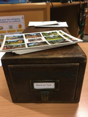 Photo of an index box of postcards.