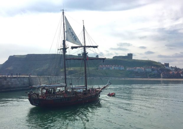 Photo of a wooden sailing ship with 2 masts arriving in Whitby