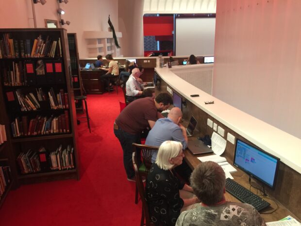 Photo of adults working on laptops in Storyhouse - the new library in Chester