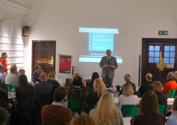 Michael Ellis speaking in front of an audience